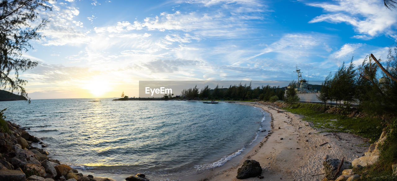 Scenic view of beach against sky during sunset