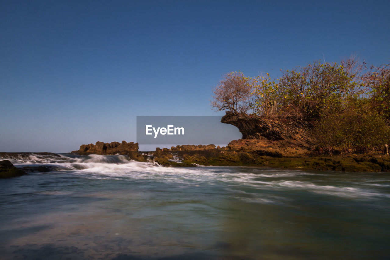 Scenic view of sea against clear sky