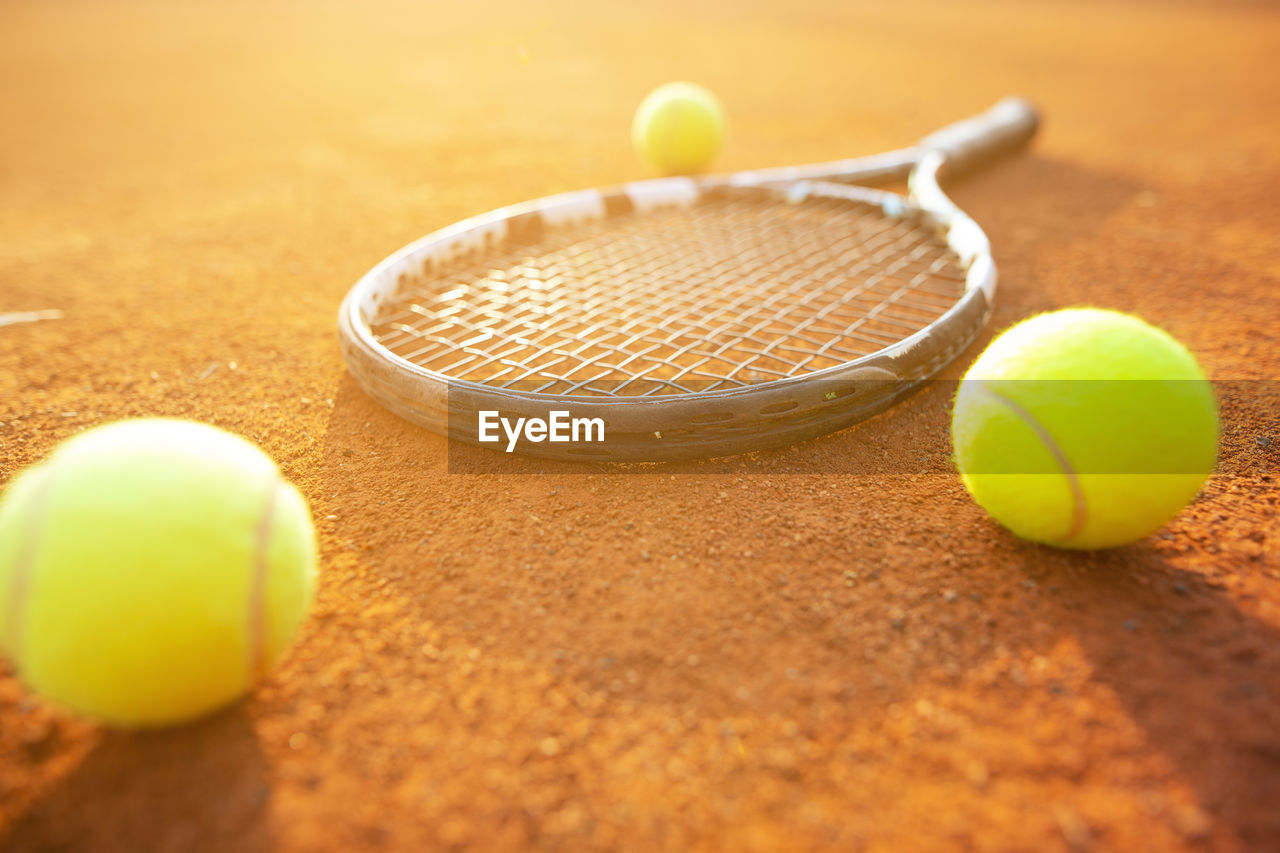 tennis, tennis ball, yellow, ball, sports, racket, tennis racket, selective focus, racket sport, no people, leisure activity, competition, close-up, recreation, sports equipment, tennis net, activity, sphere