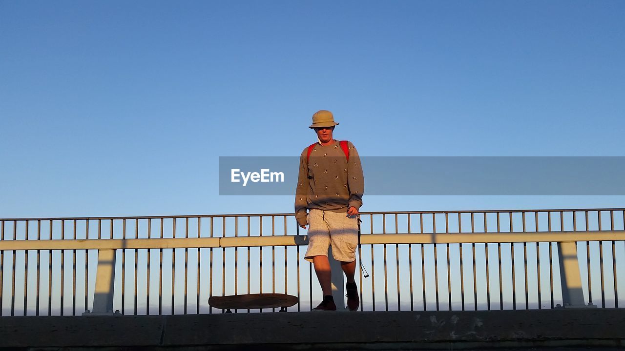 Man standing by railing