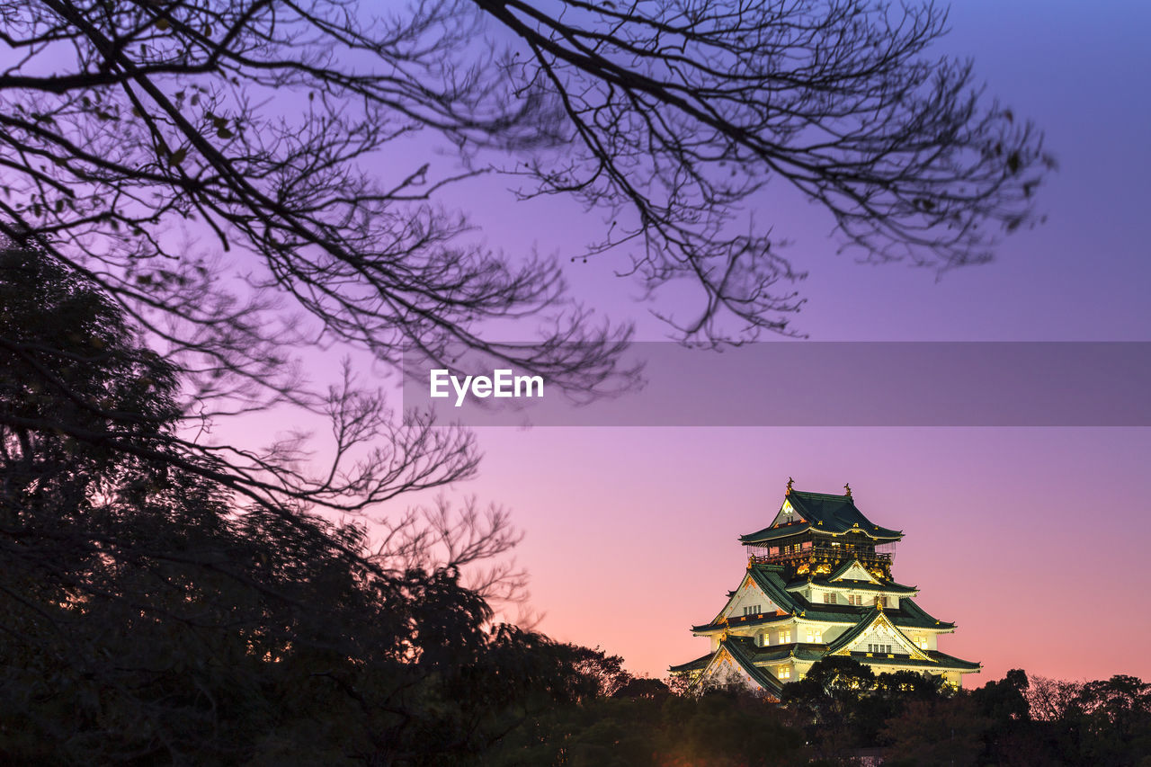 Osaka castle in evening sun light in autumn, osaka japan