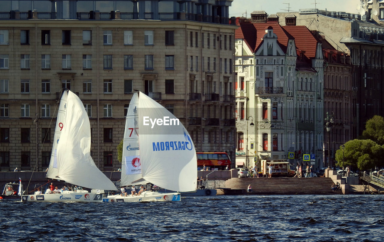 SAILBOATS IN A CITY