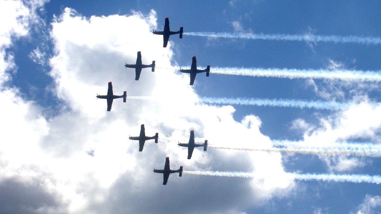 Air show in cloudy sky