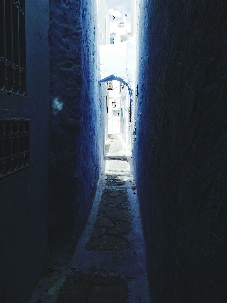 Narrow footpath amidst buildings