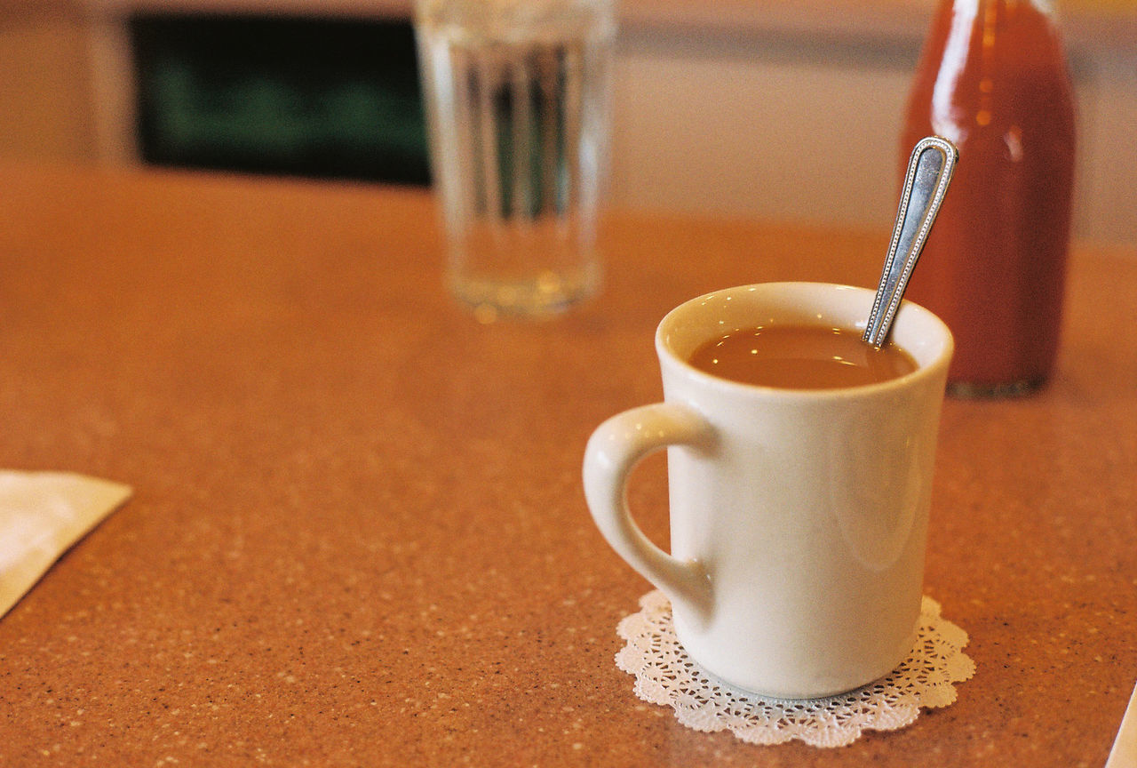 Close-up of coffee cup on table