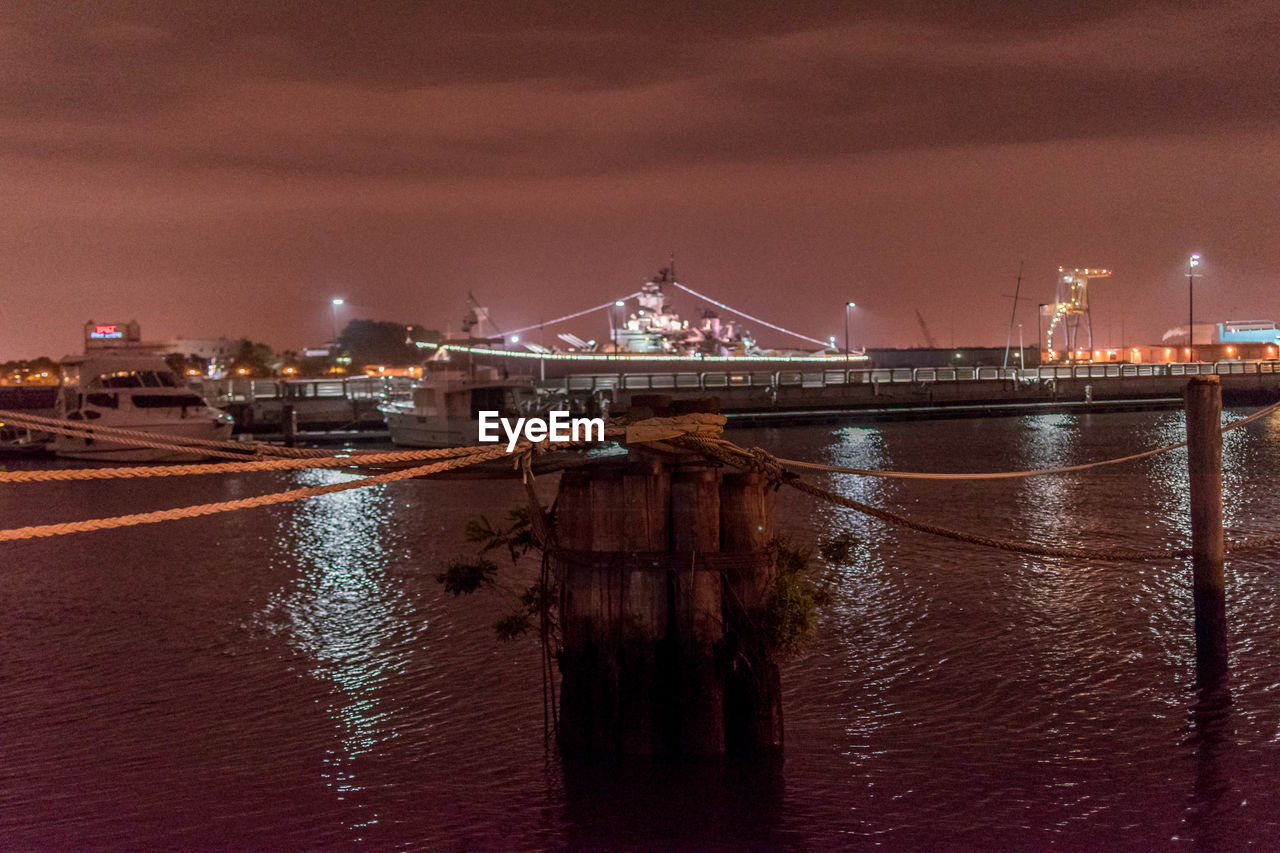 VIEW OF ILLUMINATED CITY AT NIGHT