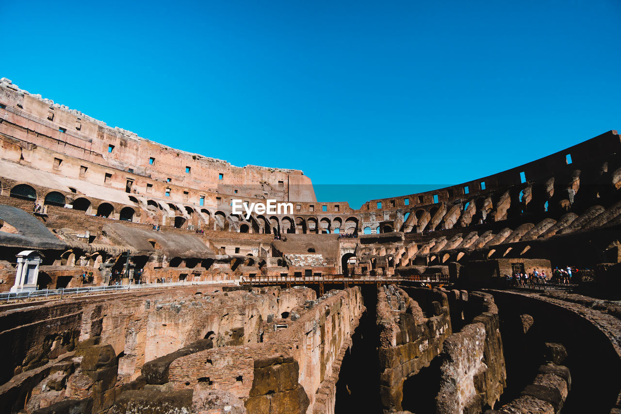 Coliseum against clear blue sky