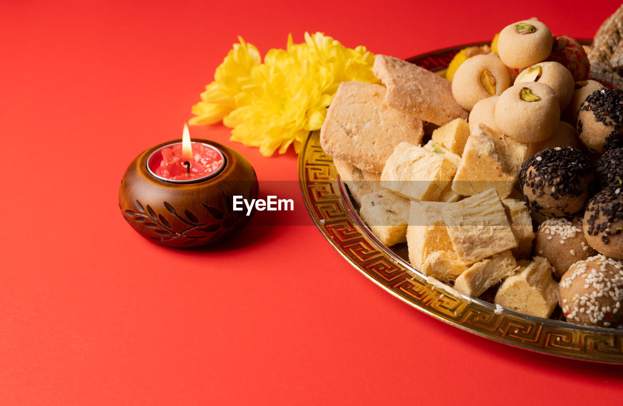 High angle view of food in bowl on yellow background