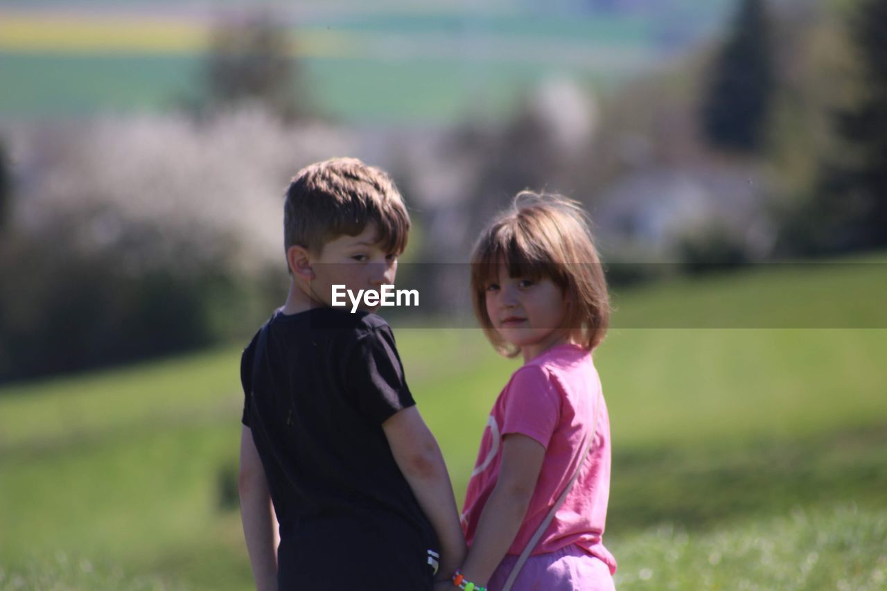 GIRL AND SON ON FIELD