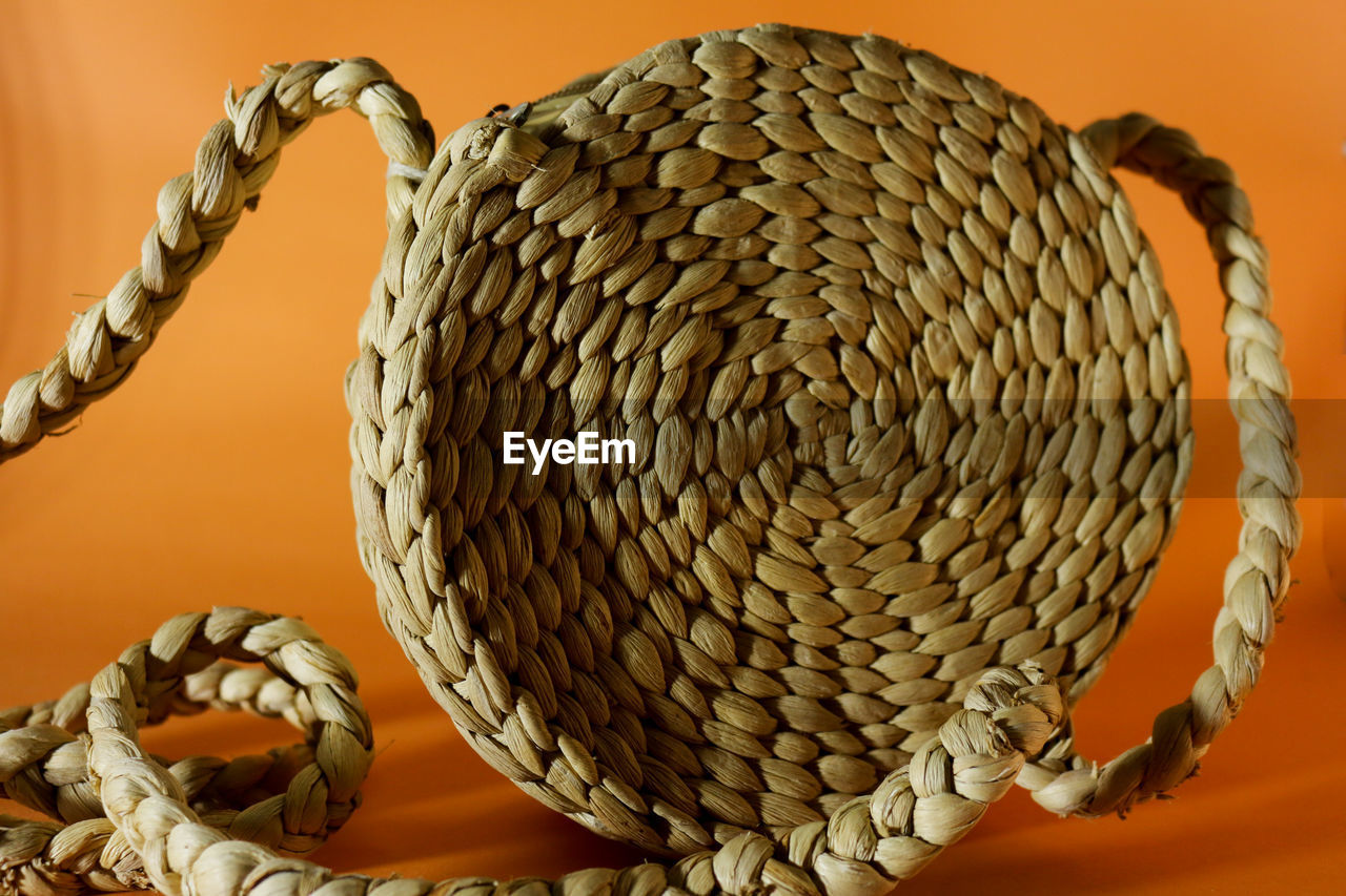 CLOSE-UP OF BASKET ON TABLE