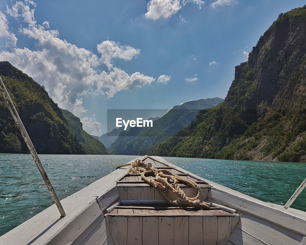 Scenic view of calm lake against mountain range