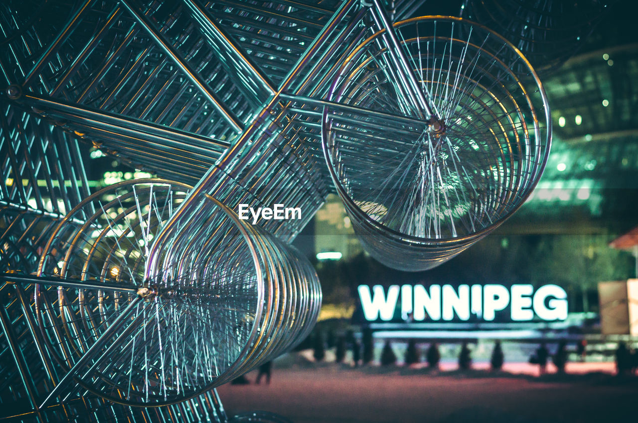 LOW ANGLE VIEW OF ILLUMINATED FERRIS WHEEL