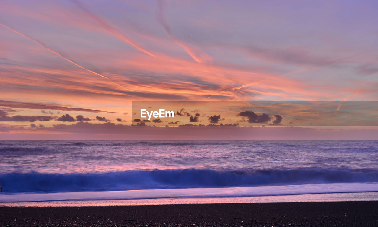 Scenic view of sea against sky during sunset