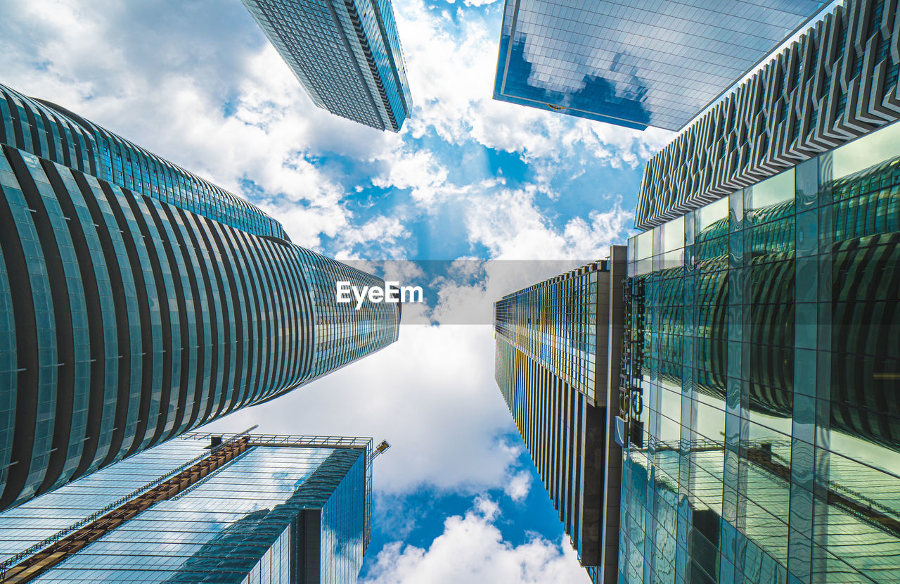 Directly below shot of modern buildings against sky