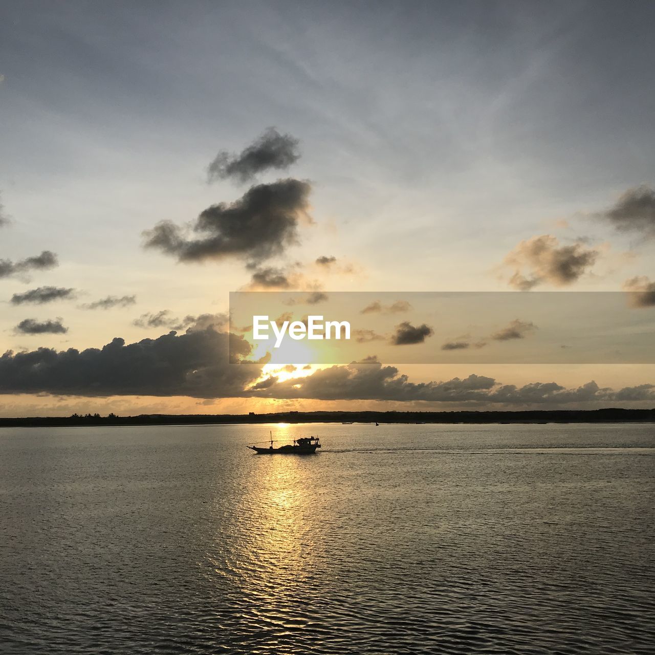 SCENIC VIEW OF SEA DURING SUNSET