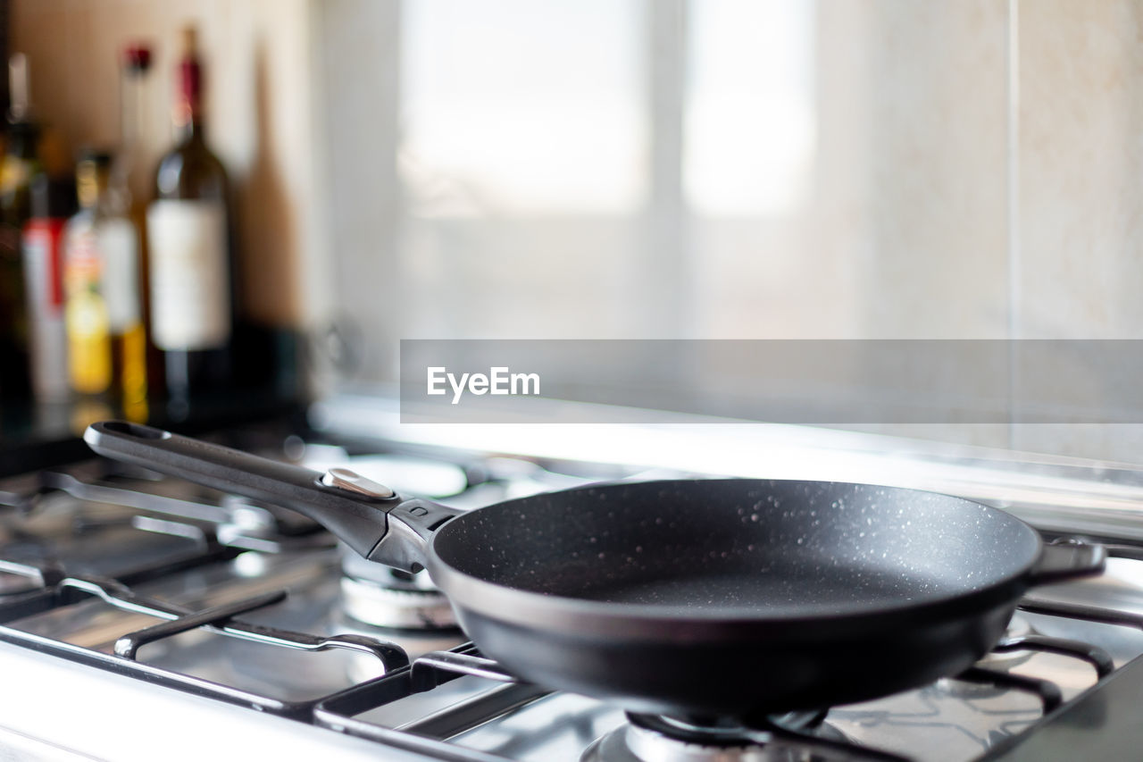 Close-up of frying pan in kitchen at home