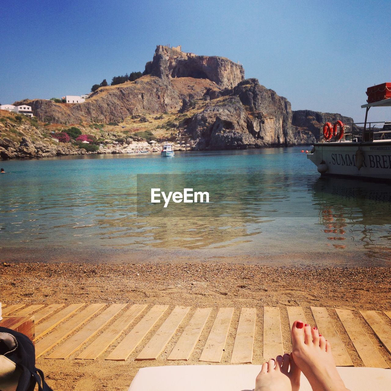 Scenic view of beach on sunny day