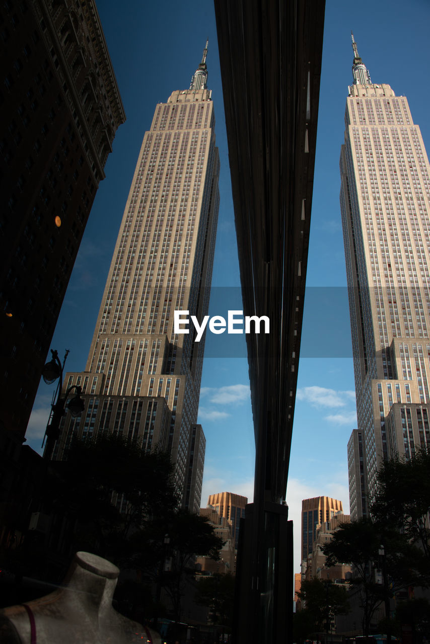 LOW ANGLE VIEW OF MODERN BUILDINGS IN CITY