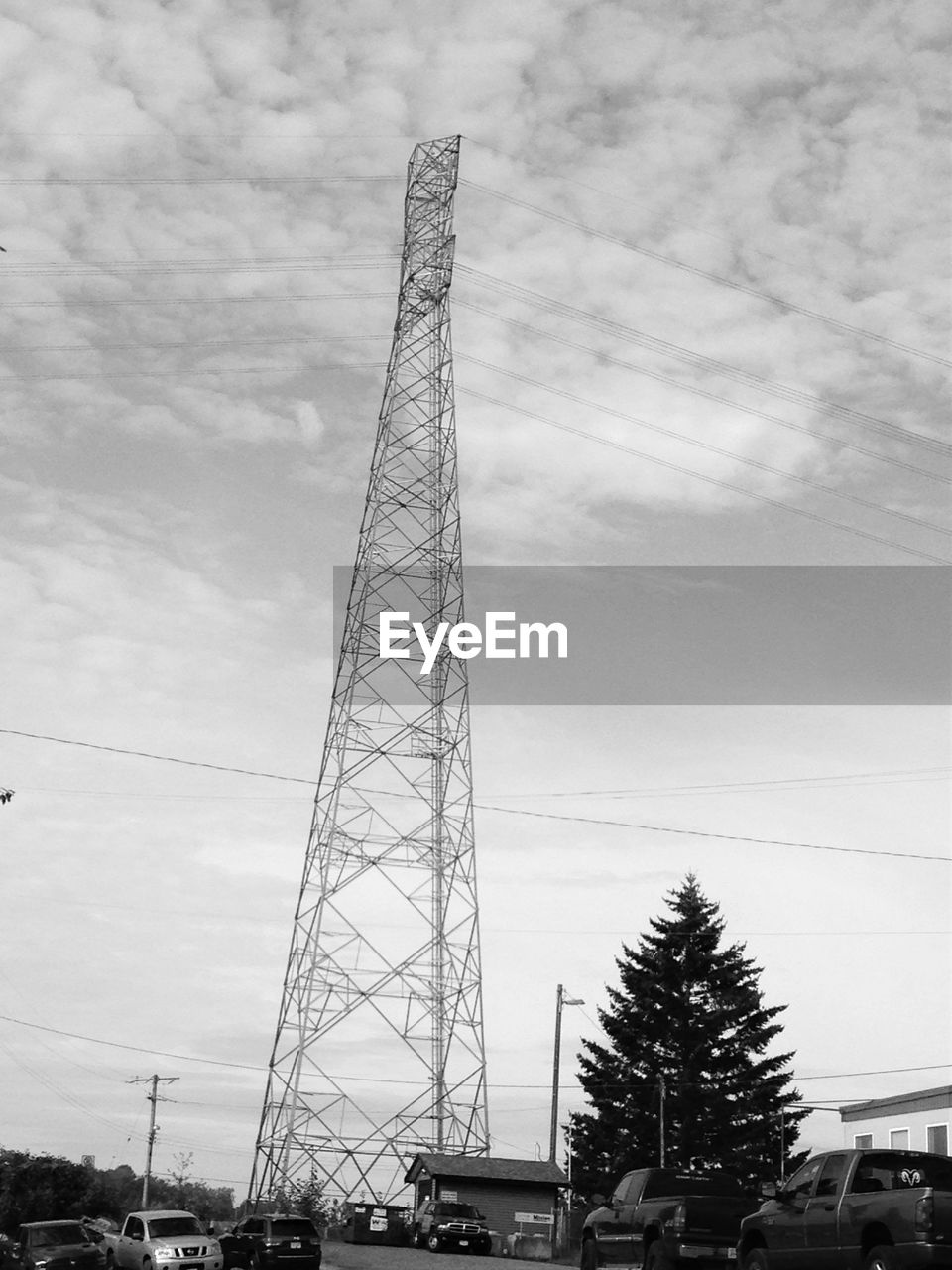 Low angle view of electricity pylon against sky