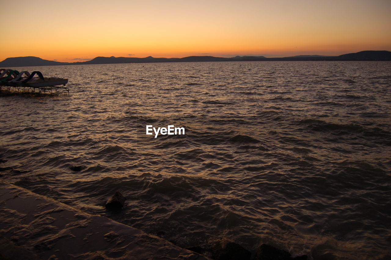 SCENIC VIEW OF SEA DURING SUNSET
