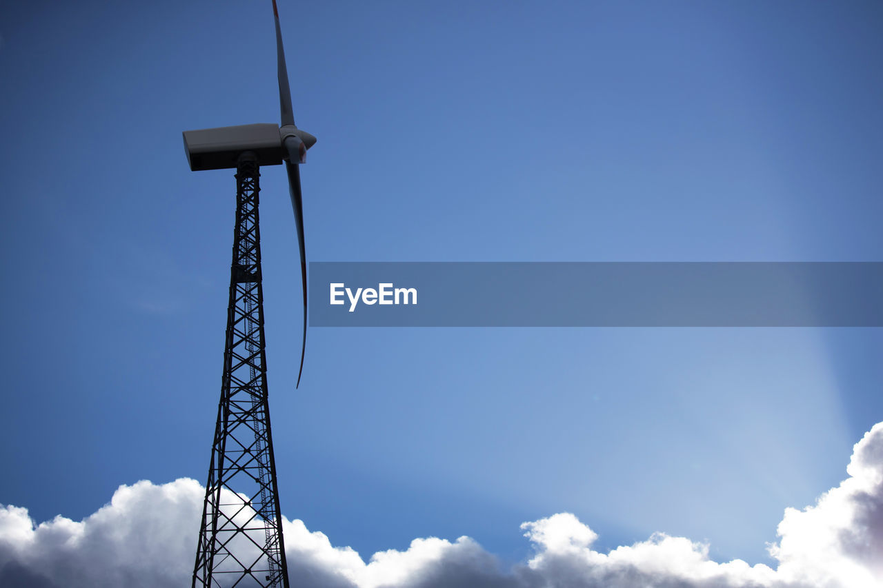 sky, cloud, blue, technology, nature, environment, power generation, renewable energy, wind turbine, wind, environmental conservation, windmill, alternative energy, wind power, no people, turbine, low angle view, outdoors, machine, day, electricity, copy space, industry, cloudscape, architecture, equipment, built structure, beauty in nature