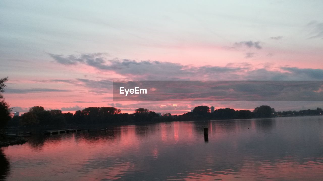 SCENIC VIEW OF SUNSET OVER LAKE