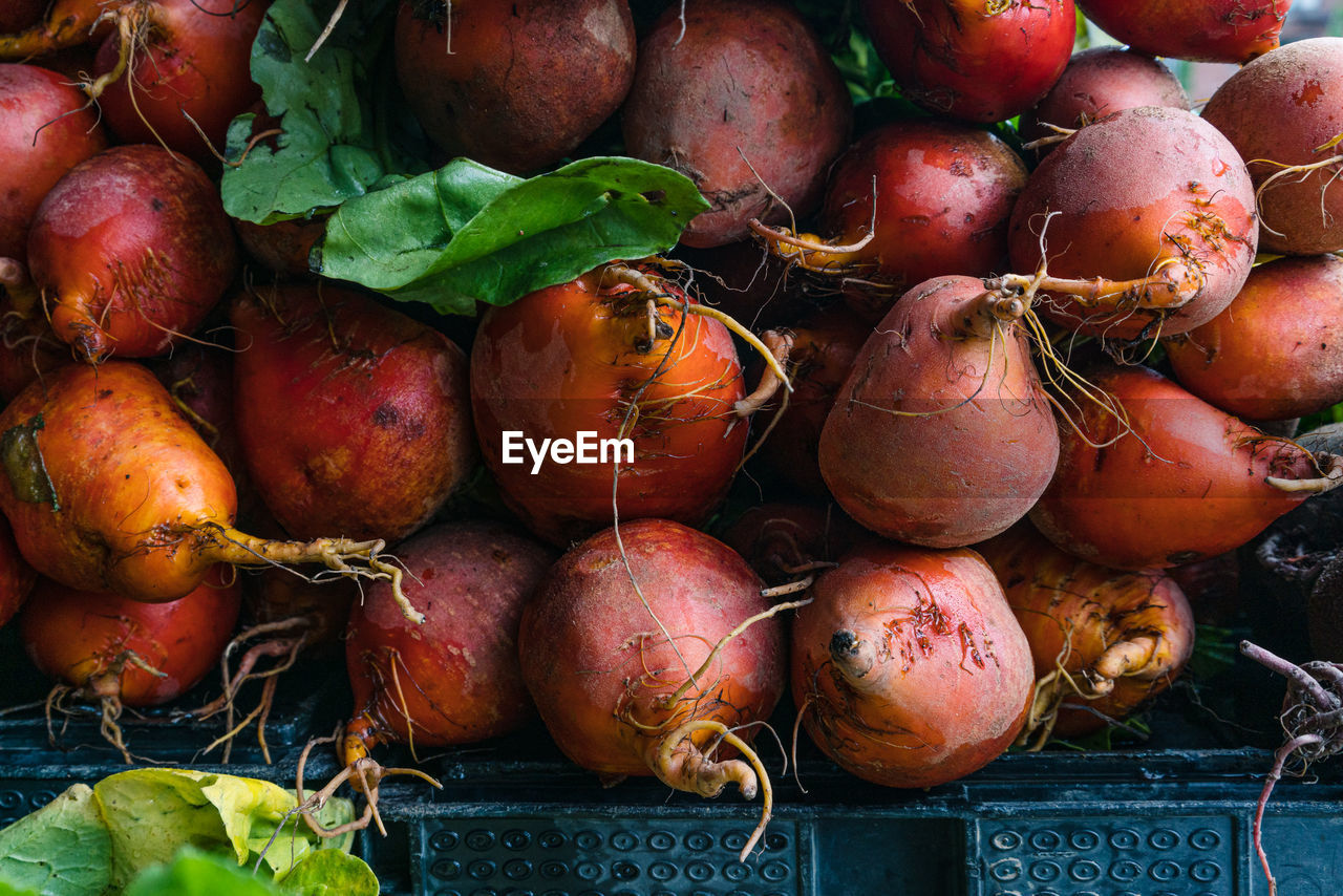 Close-up of root vegetables for sale at market stall