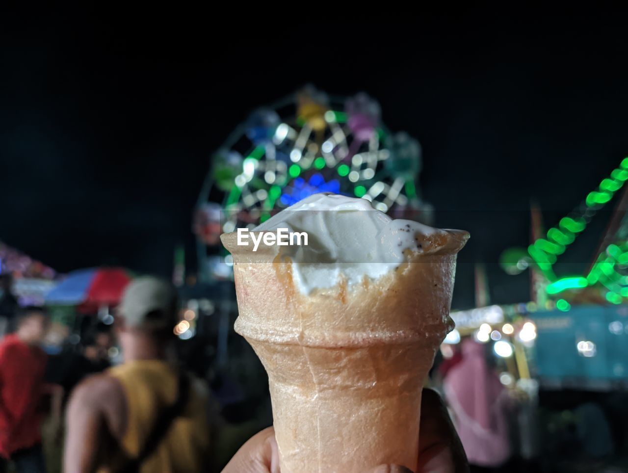 Close-up of ice cream cone against black background