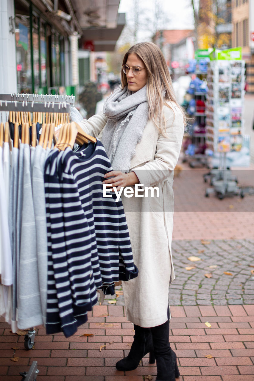 Full length of woman standing in store