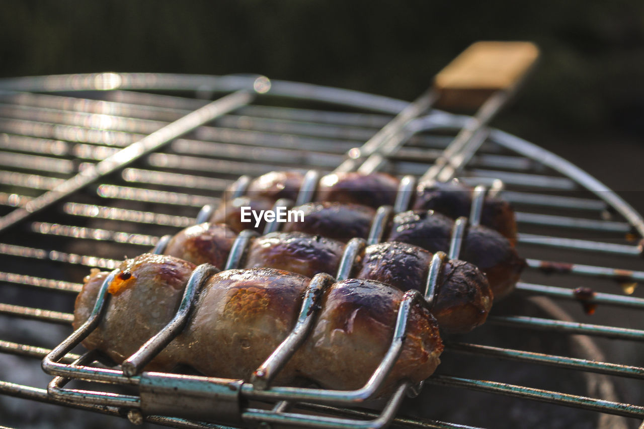 Close-up of meat on barbecue grill