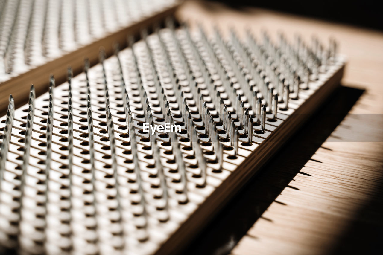 Wooden board sadhu with nails for practicing yoga.