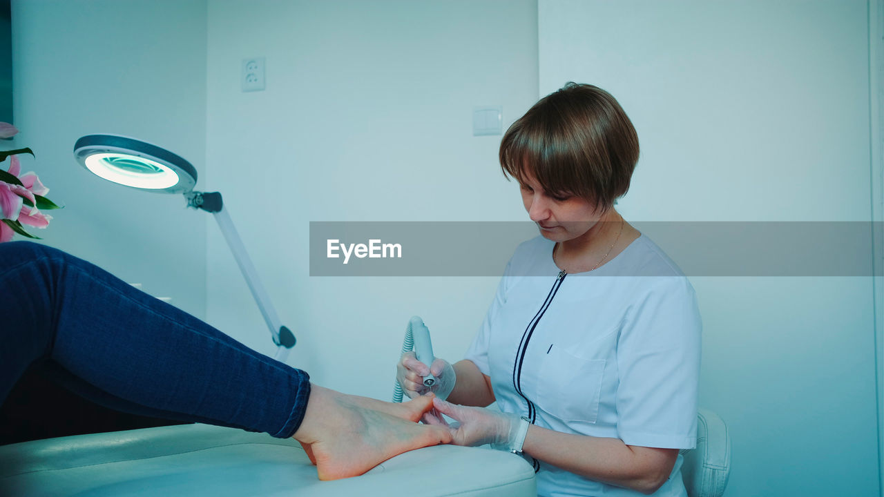 side view of doctor examining patient in hospital