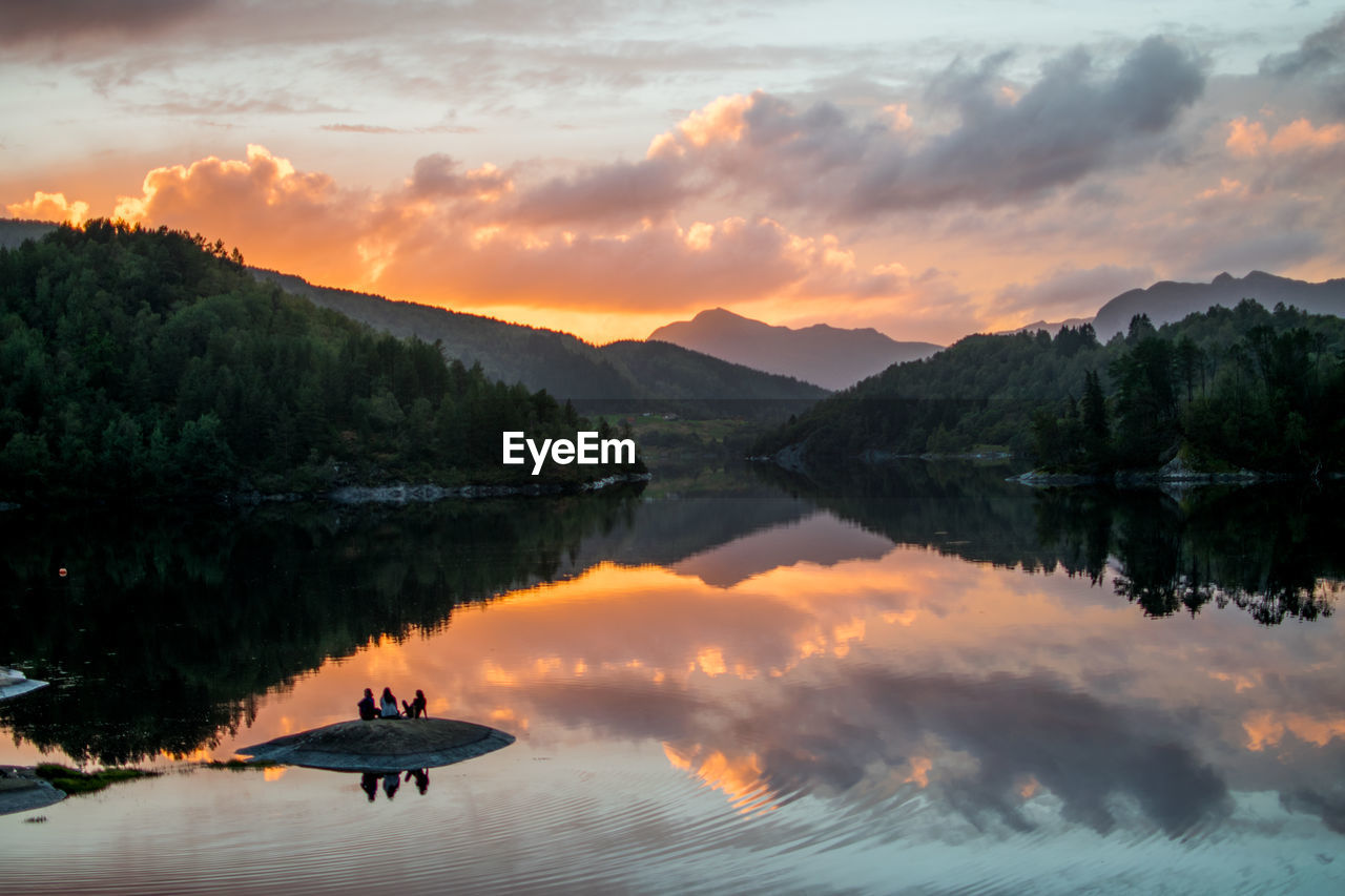 Scenic view of lake against sky during sunset