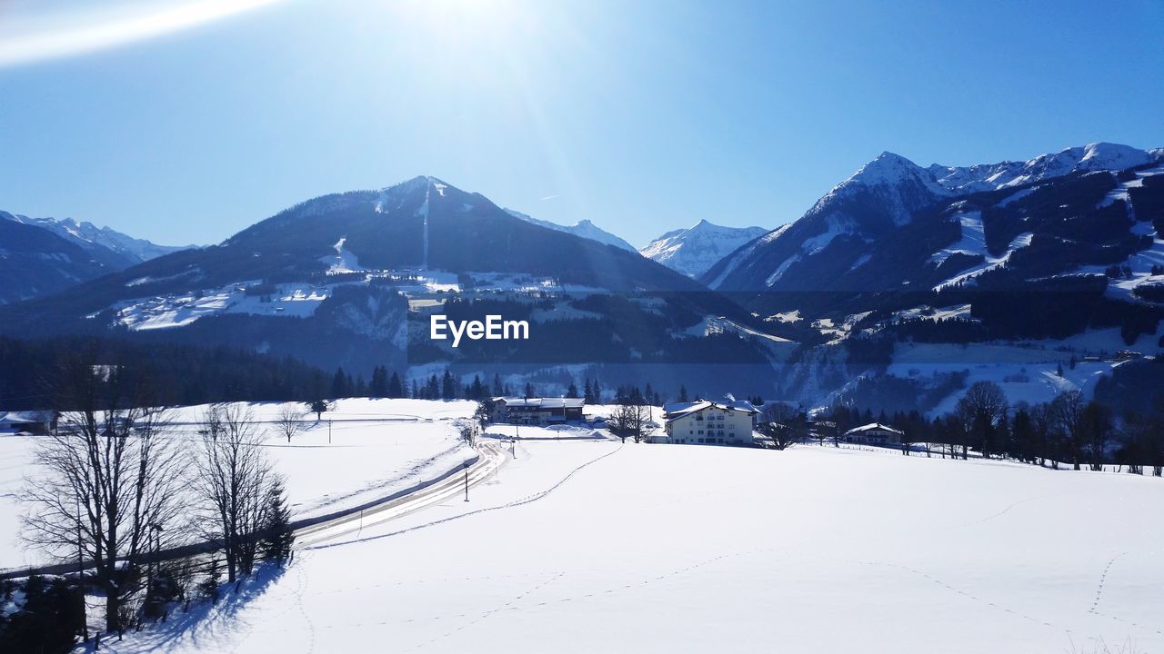 Scenic view of snow covered mountains against sky