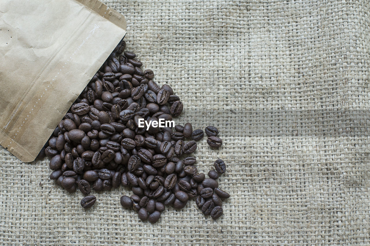 High angle view of coffee beans on burlap