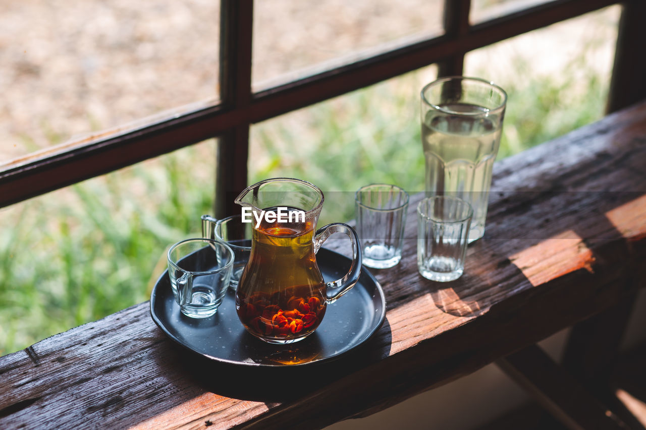 Drink hot tea in a beautifully prepared glass jug ready to serve.