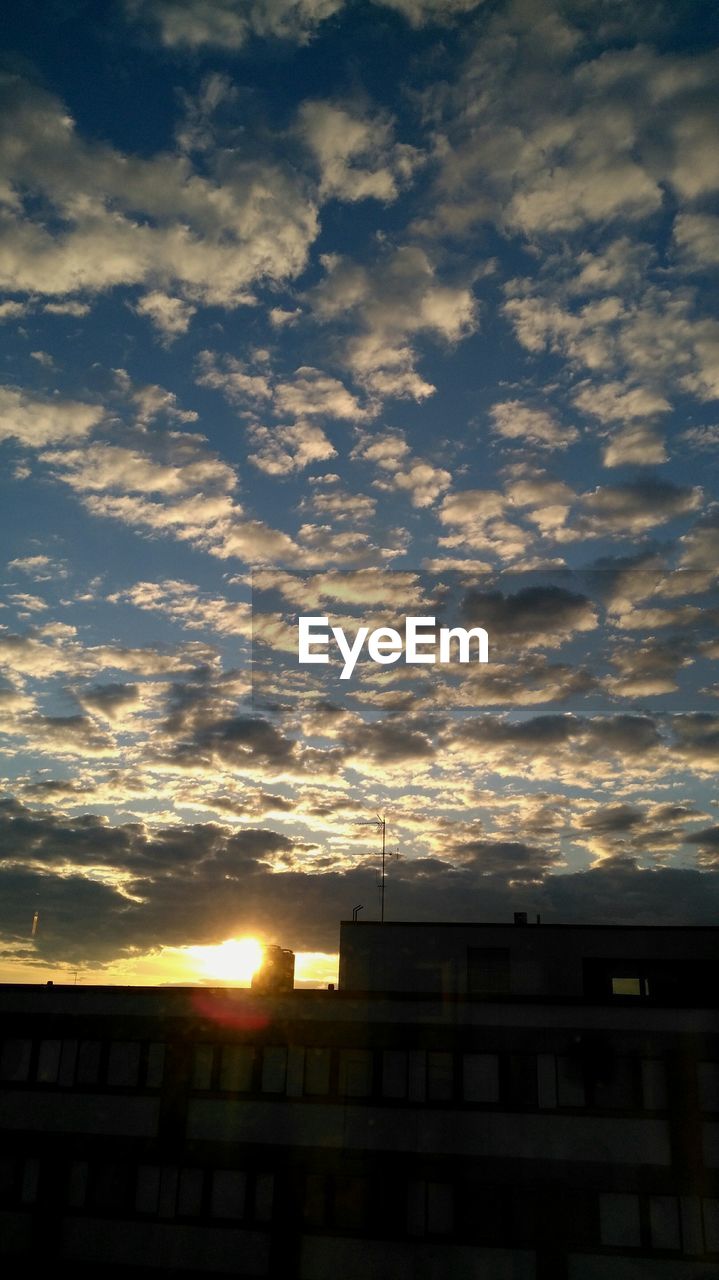 LOW ANGLE VIEW OF CLOUDY SKY AT SUNSET