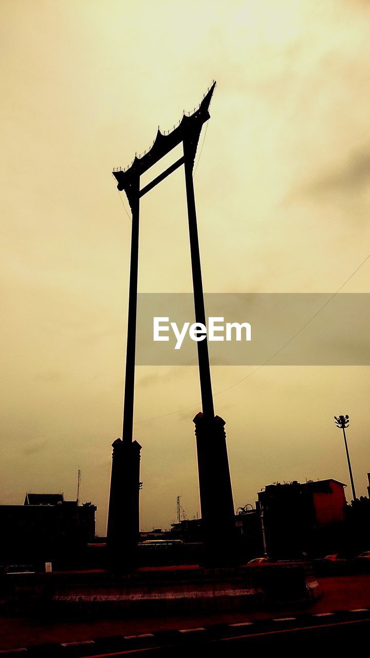 LOW ANGLE VIEW OF BUILT STRUCTURE AT SUNSET