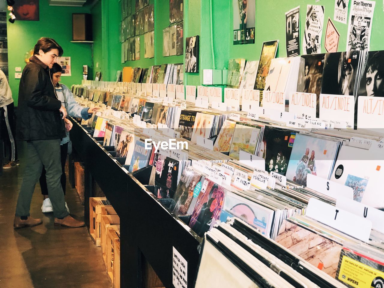 WOMAN STANDING IN STORE