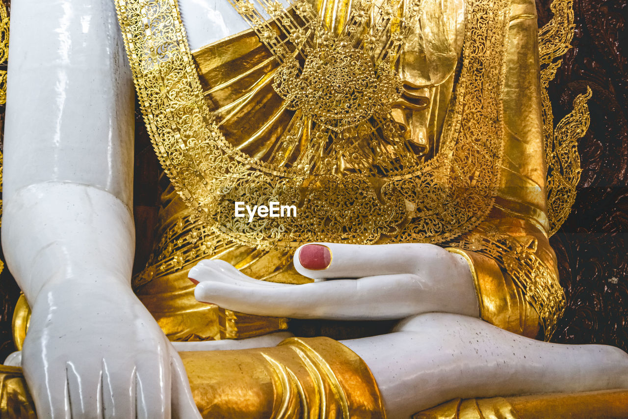 Close-up of the sitting buddha in rangoon, myanmar