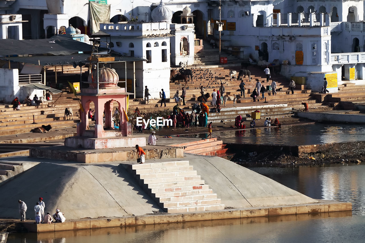 Pilgrims at pushkar lake on sunny day