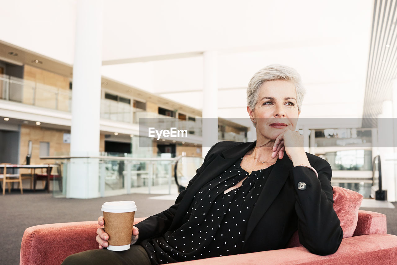 Portrait of woman drinking coffee