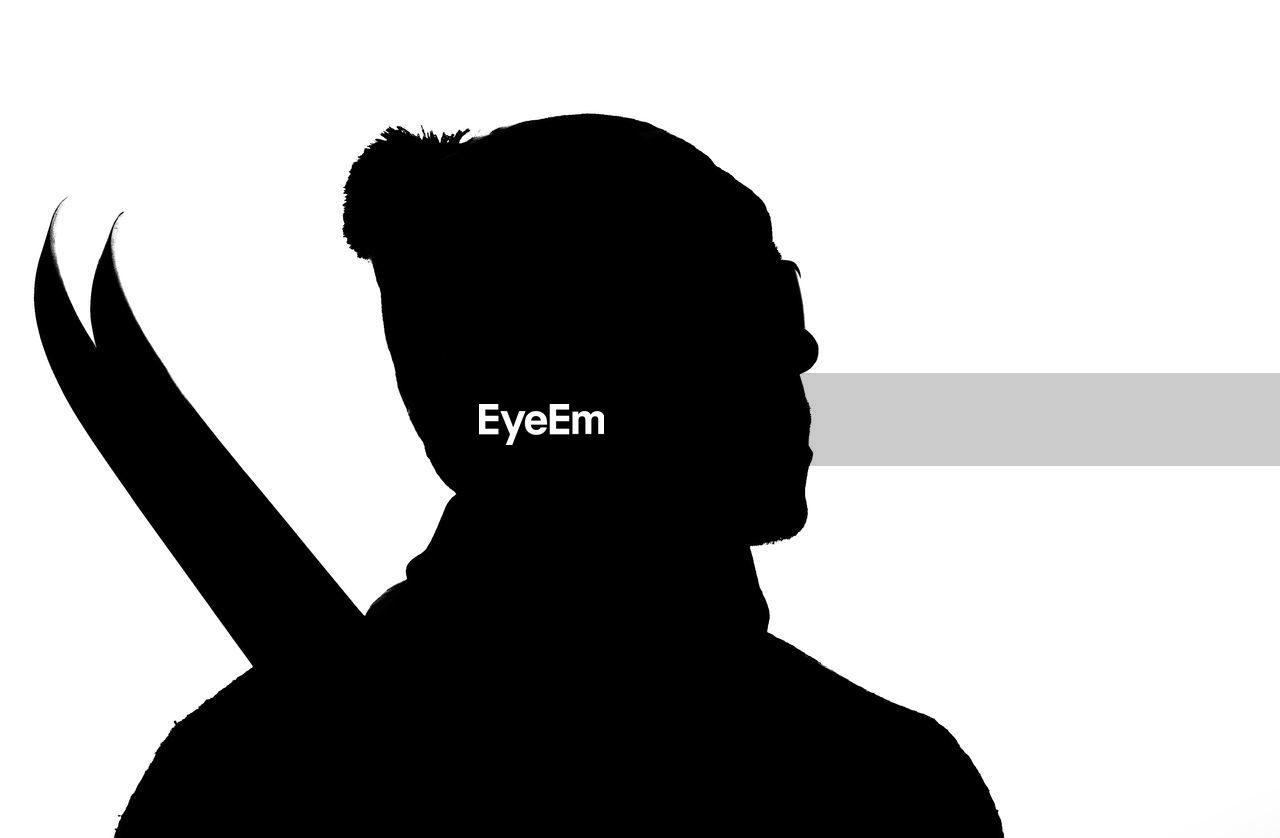 CLOSE-UP PORTRAIT OF SILHOUETTE MAN STANDING AGAINST WHITE BACKGROUND