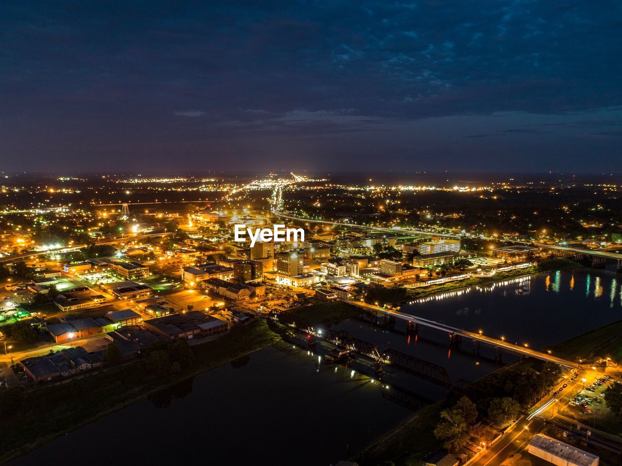 High angle view of illuminated buildings in city at night