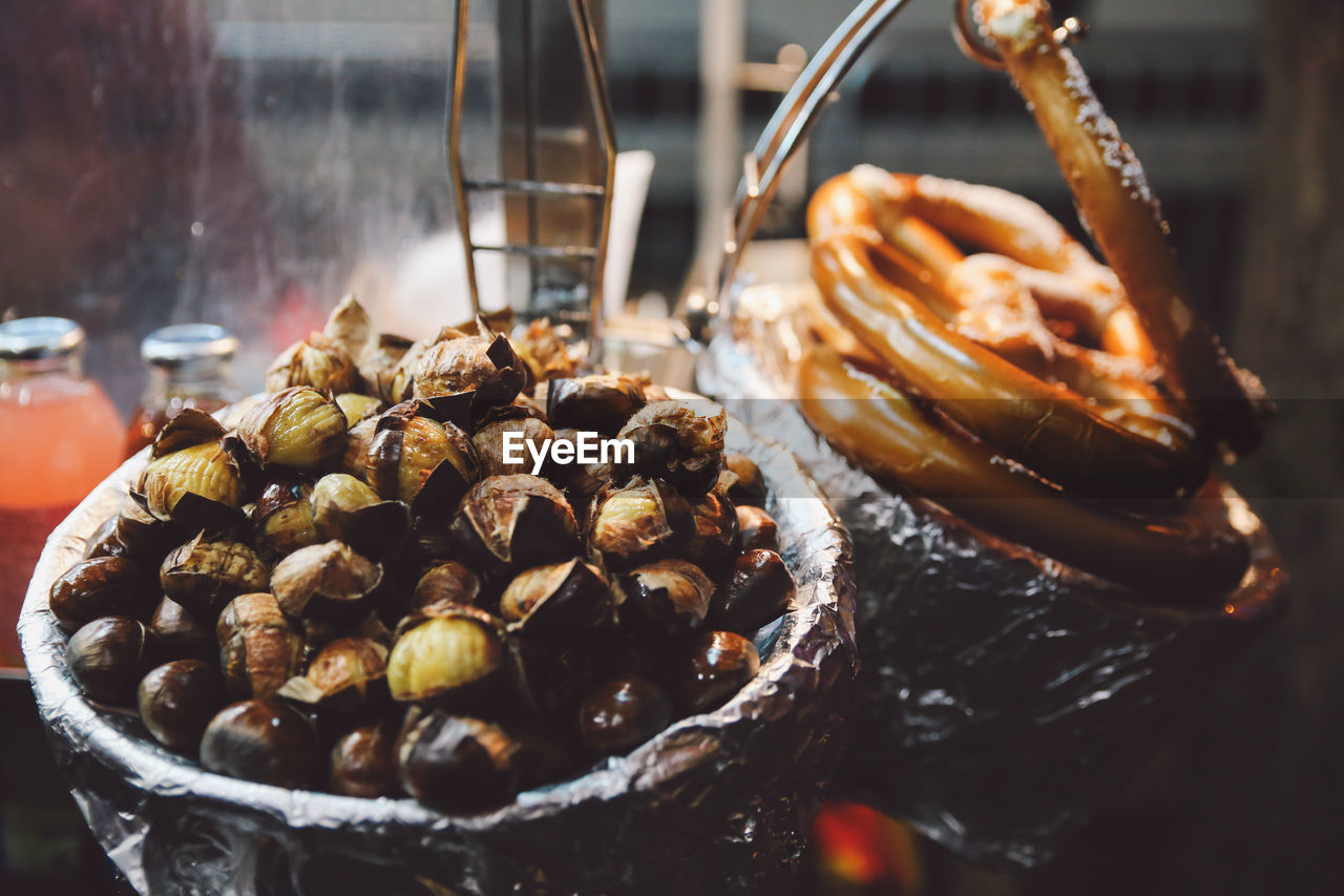 High angle view of pretzels and chestnuts for sale in shop