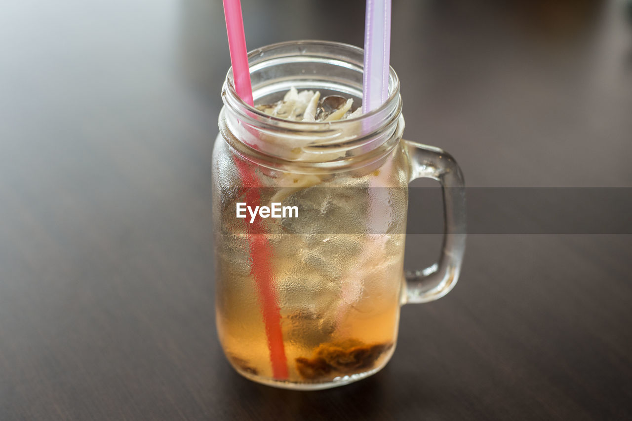 High angle view of drink in glass jar on wooden table