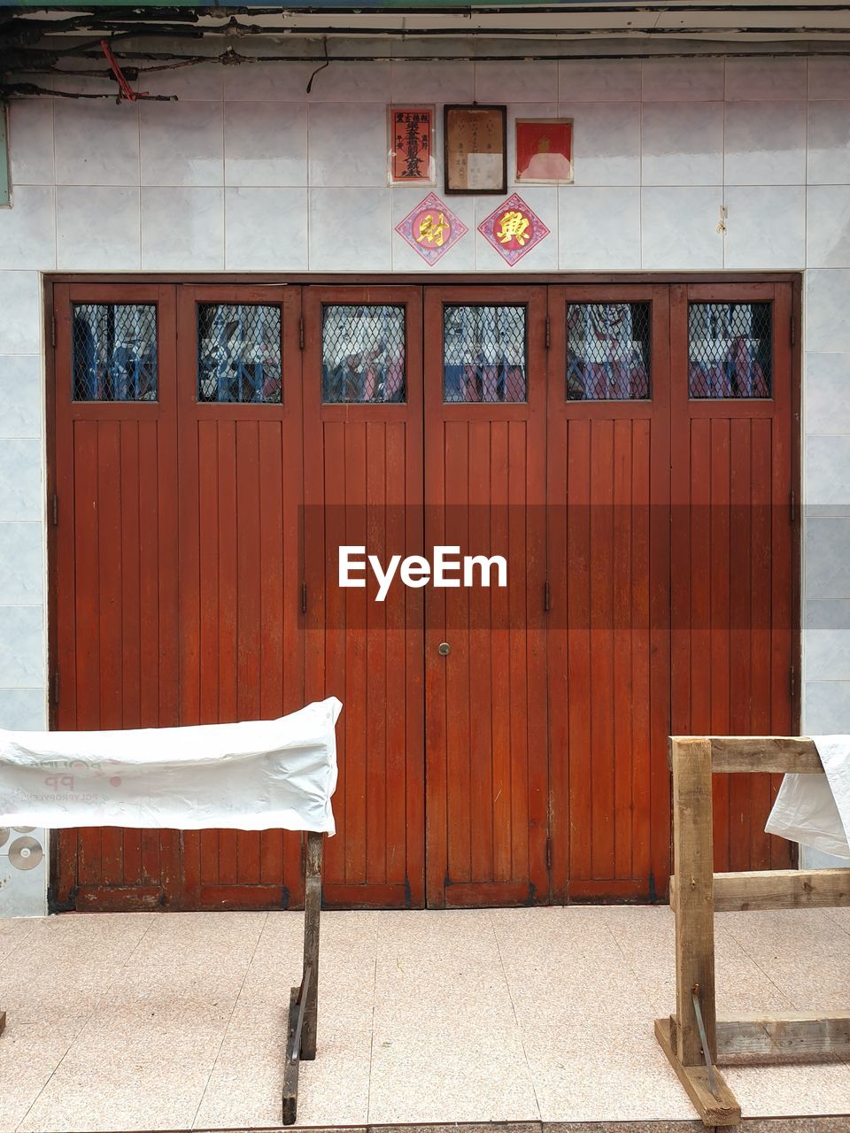 Empty bench against building