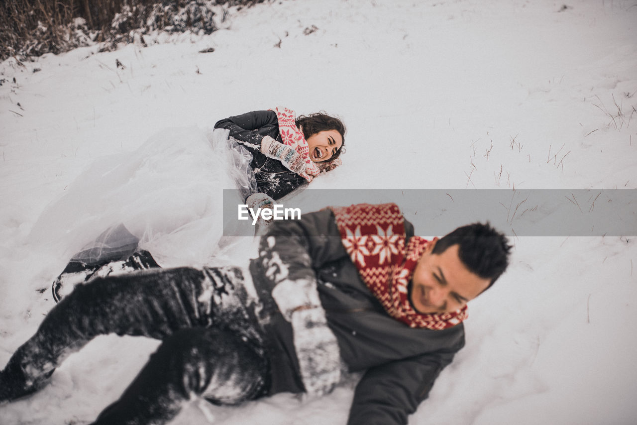 high angle view of woman standing on snow during winter