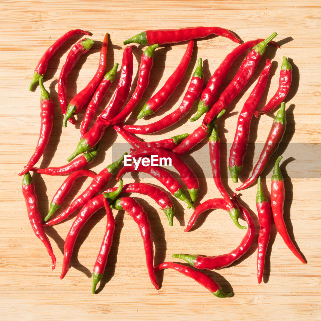 Directly above shot of red chili peppers on table