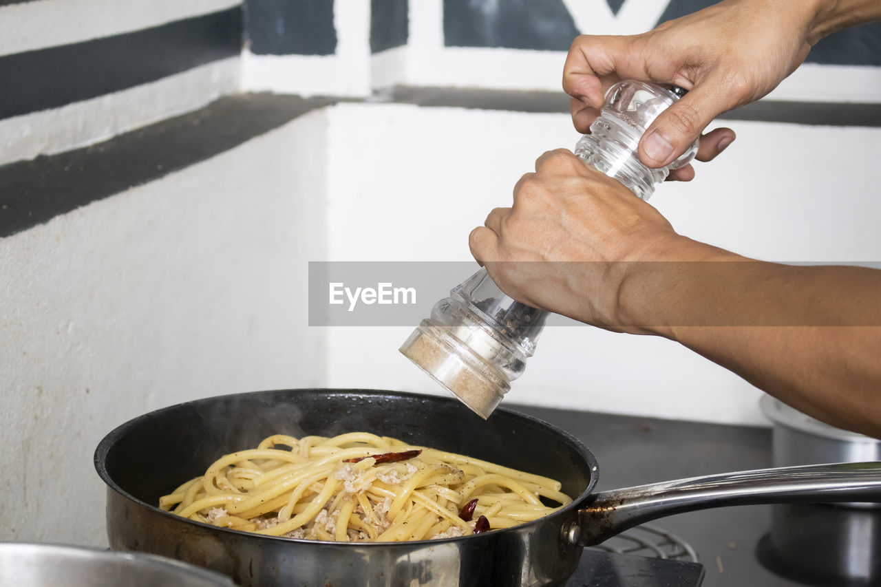 Midsection of man preparing food
